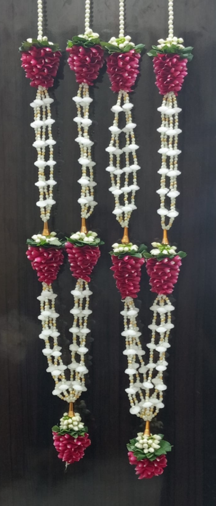 Camphor with fresh flower garlands