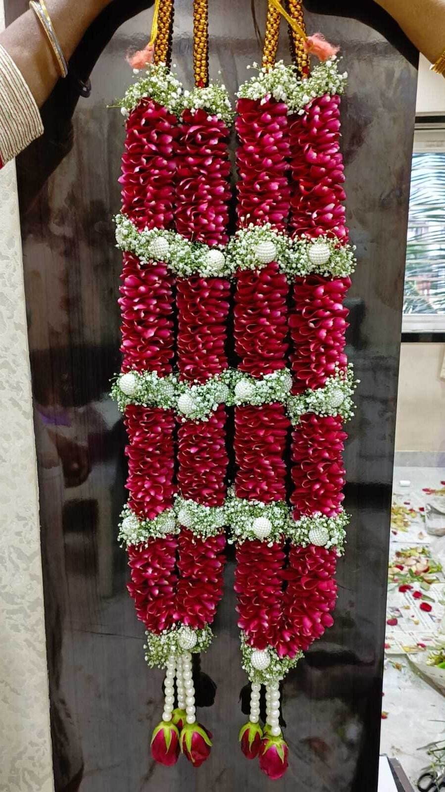 Rose petals with gypsy/ baby breath flowers with pearl ball