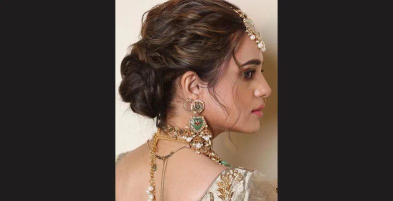 Engagement Hairstyle for Bride - Messy Bun with Maang Tikka and Side Twists